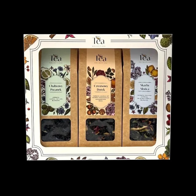 Zestaw prezentowy z trzema herbatami liściastymi Tea Selection dostępny w sklepie z kawą, zawierający kompozycje Chabrowy Poranek, Cytrusowy Dotyk i Skarby Słońca, zapakowany w eleganckie pudełko ozdobione ilustracjami roślinnymi – idealny na prezent wielkanocny.